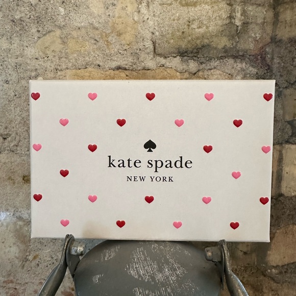 Kate Spade wallet is a light pink wallet adorned with small heart-shaped studs - Picture 3 of 16